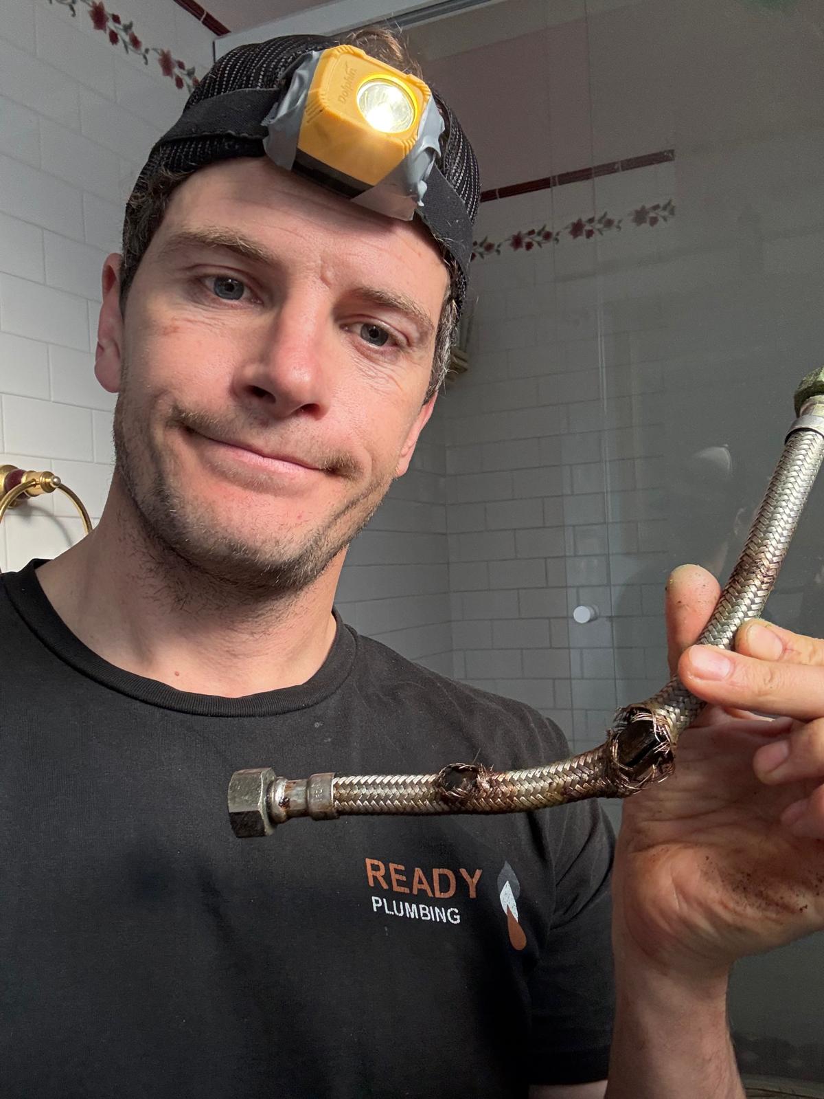 Failed braided flexible hose removed by Ready Plumbing, a common cause of indoor flooding