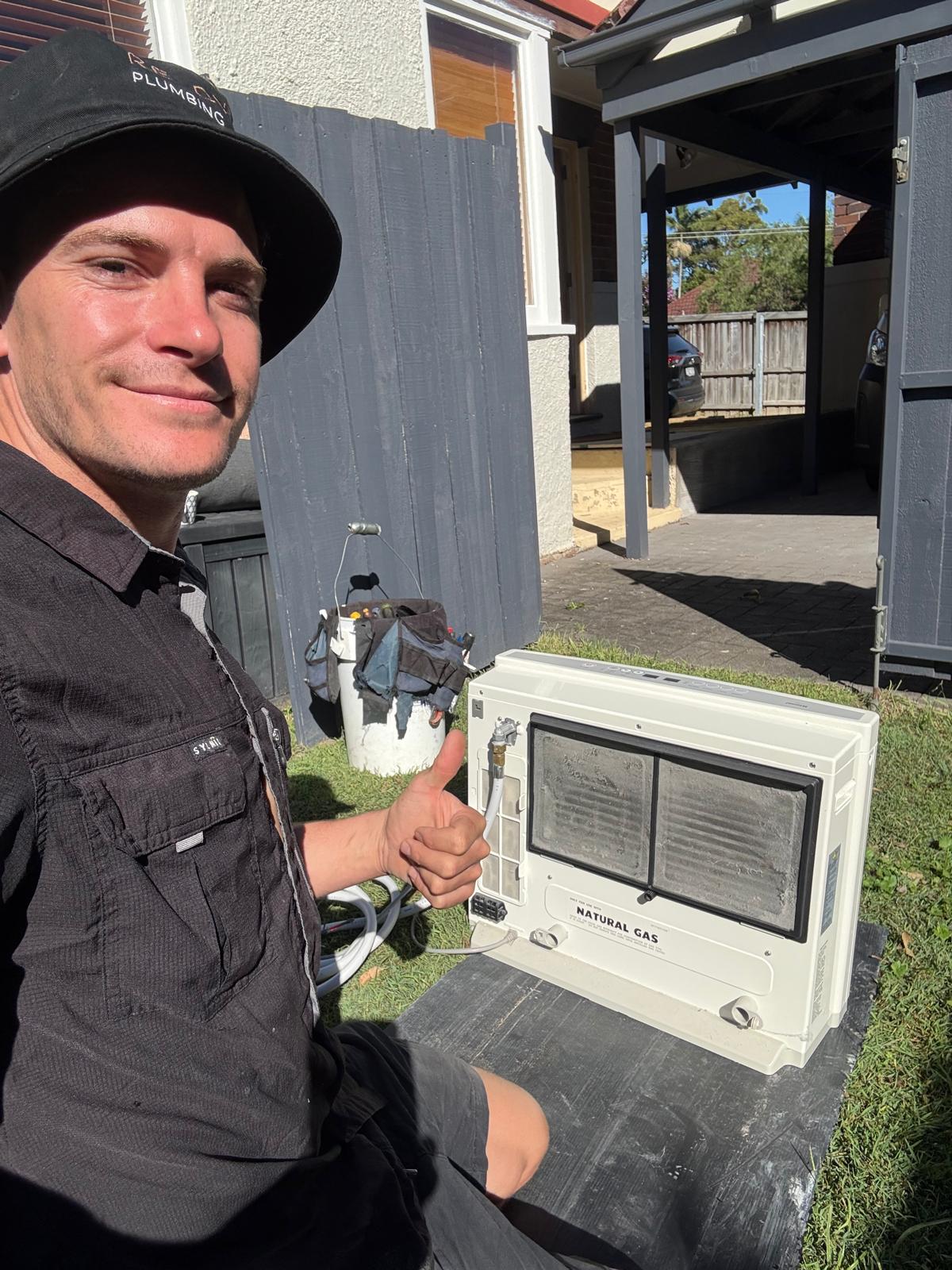 Ready Plumbing gas fitter connecting a natural gas space heater