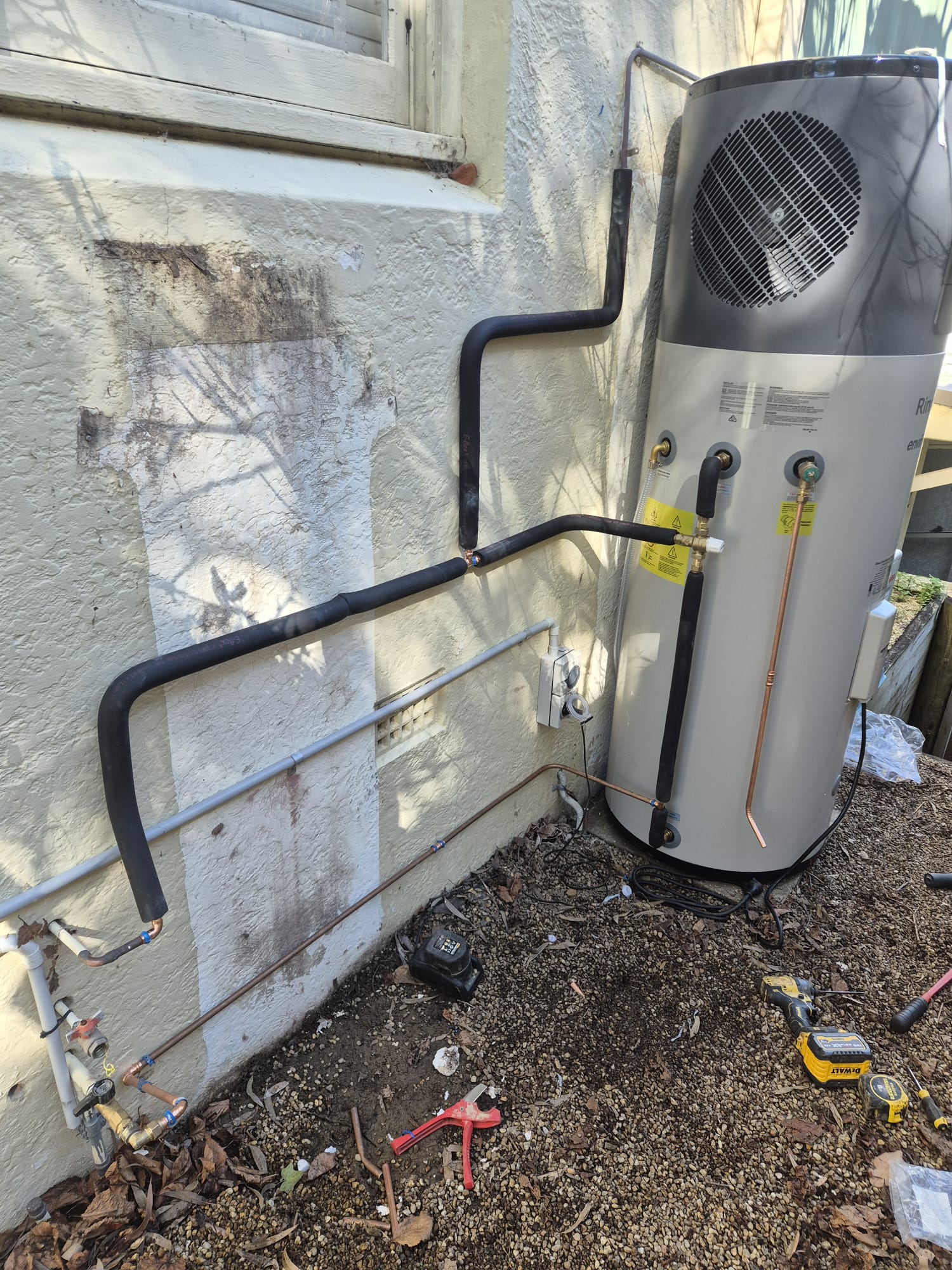 Hot water system installation in progress with new lagged pipework