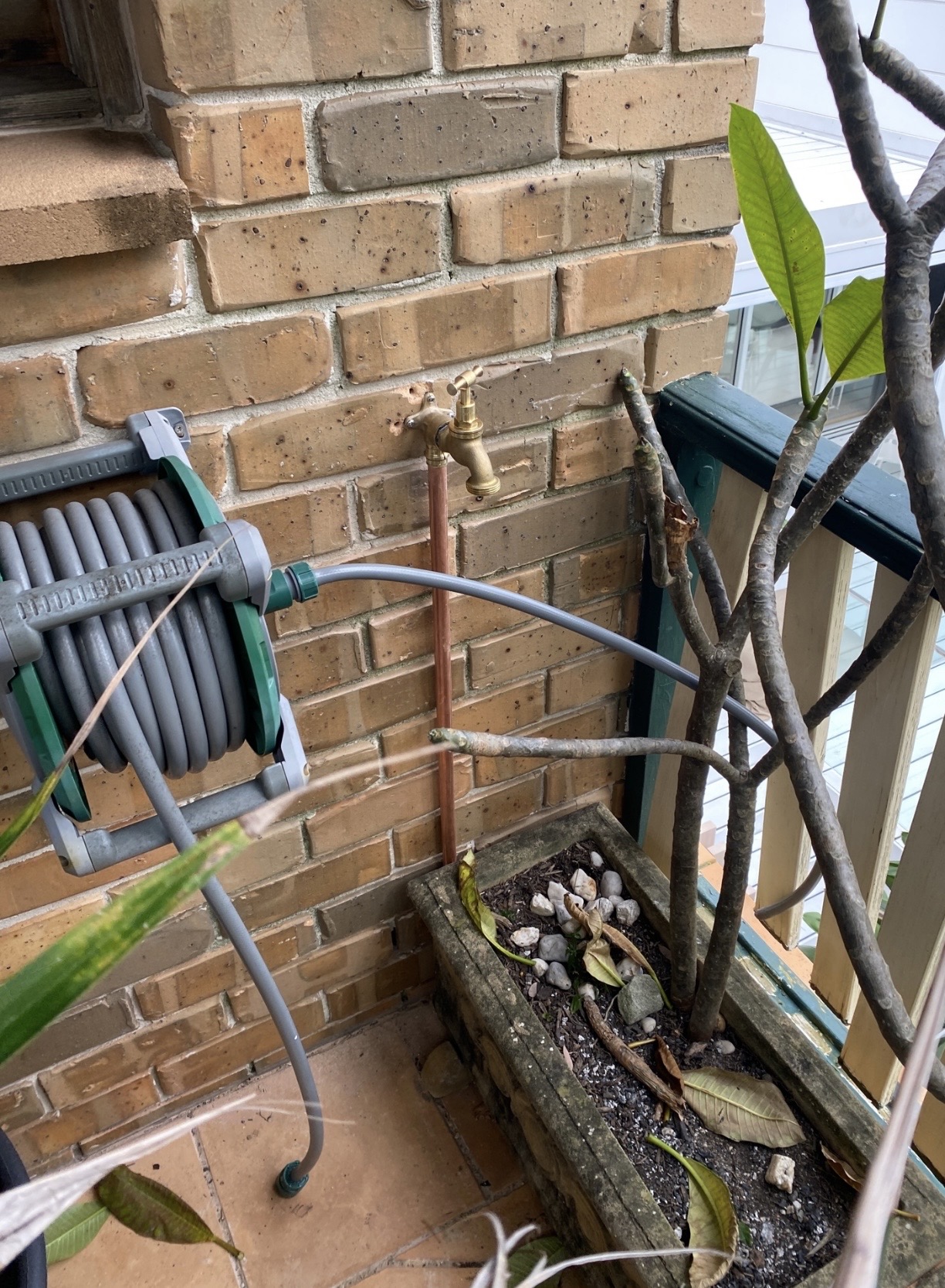 New copper hose tap installed on an outdoor wall by Ready Plumbing