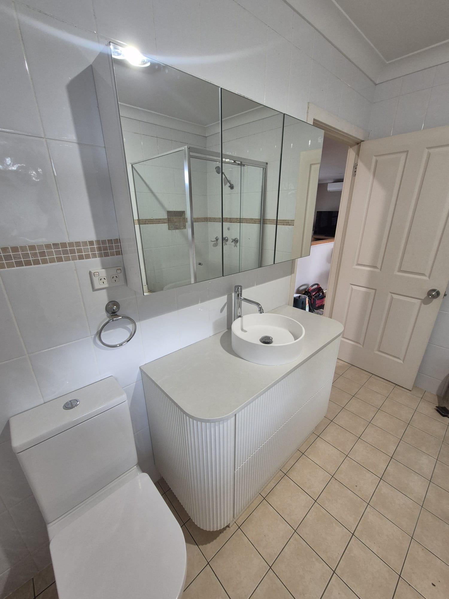 New vanity with round basin, toilet and shaving cabinet installed in the Warriewood bathroom, siliconed and tested