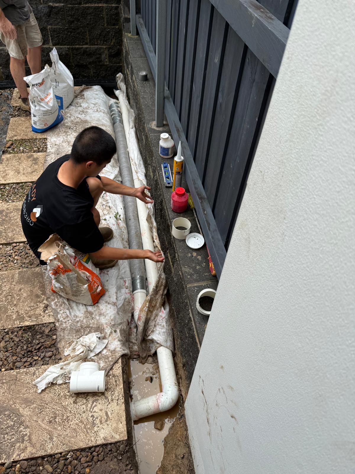New stormwater pipework being installed alongside a Sydney home