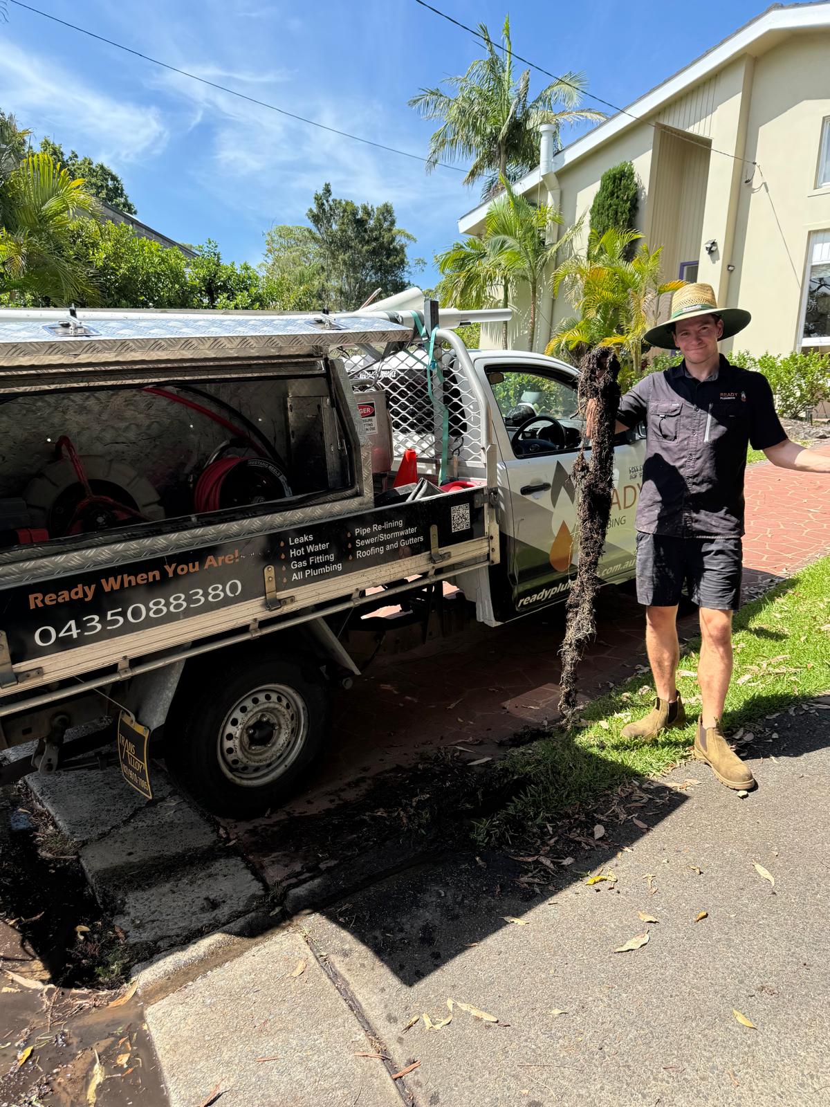 Tree roots pulled out of a blocked sewer drain by Ready Plumbing