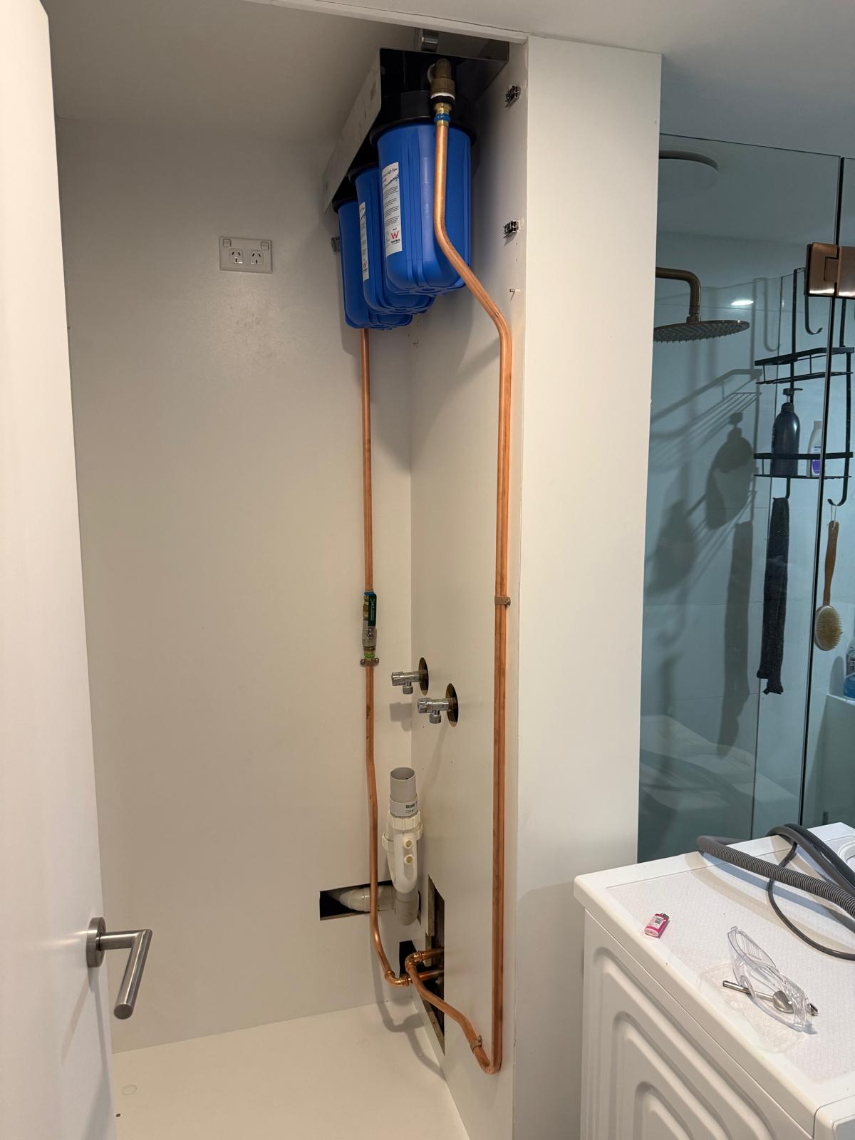 Whole house water filter system installed by Ready Plumbing with copper pipework